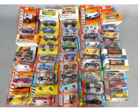 Matchbox - Approximately 40 boxed / blister carded modern issue Matchbox diecast vehicles. Lot includes  Mattel Wheel #25 Mer