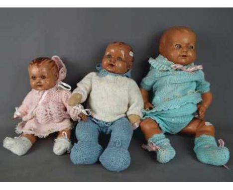Dolls - a collection of three composition dolls to include a boy baby doll with jointed arms, legs and head with sleeping blu
