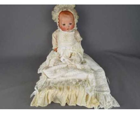 Armand Marseille - a ceramic faced Armand Marseille doll with jointed  composition arms and legs, ceramic face, sleeping blue