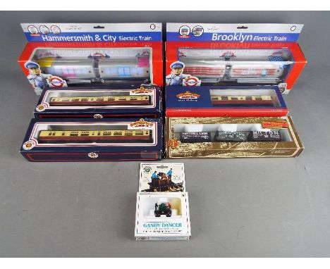Bachmann - A collection of seven boxed HO and OO gauge model railway engines and rolling stock by Bachmann. Lot includes Bach