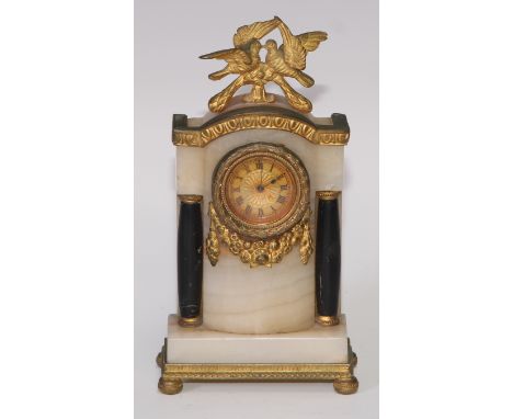 An Empire design gilt metal and black marble mounted onyx diminutive timepiece, 3cm gilt engine turned dial inscribed with Ro