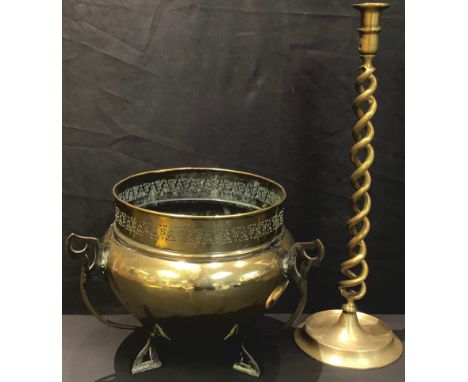 An Art Nouveau brass jardiniere; a tall 19th century cast brass open-twist candlestick, 50cm high (2) 