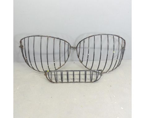 A pair of painted metal hay racks, approximately 85x60x50cm, and a similar planter. (3) 