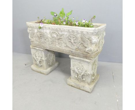 A three-section stone trough on twin pedestal base. 70x53x24cm. 