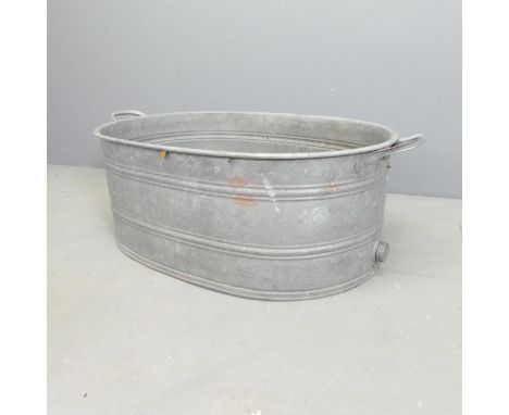 A vintage galvanised wash basin. 85x30x50cm.