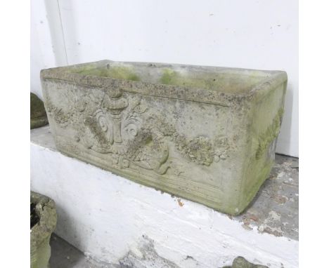 A weathered stone garden trough, with mythical beast and foliate decoration. 80x34x40cm. 