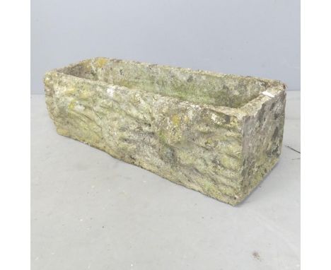 A small weathered concrete garden trough. 63x19x22cm. 
