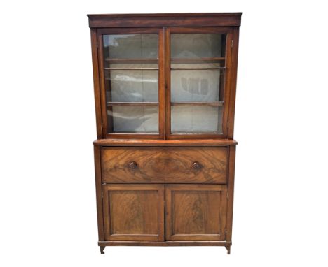 A Victorian mahogany secretaire bookcase, the upper bookcase section with twin glazed drawers enclosing shelves, the lower se