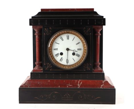 A Victorian black slate and rouge marble mantel clock, the white enamel dial with Roman numerals, 29cm wide.