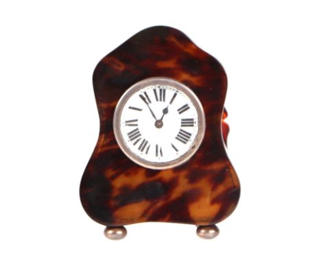 A French tortoiseshell mantle clock, the white dial with Roman numerals, on four white metal bun feet, 11cms high.Condition R
