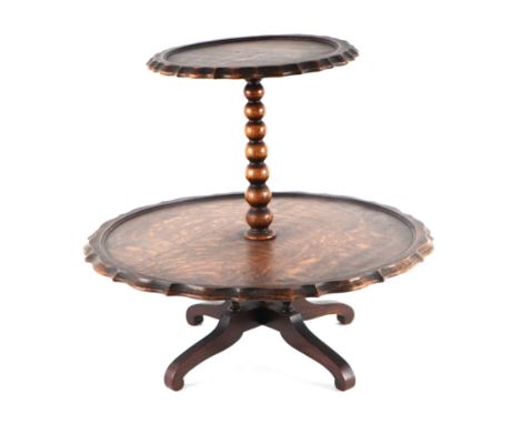 An early 20th century oak two-tier Lazy Susan on bobbin turned column and quatrefoil base, 43cm high. 