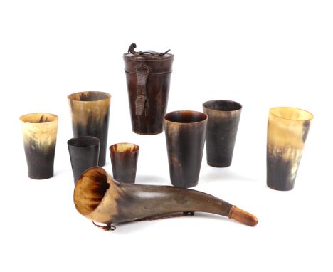 A set of 19th century graduated horn beakers in a leather carrying case; together with other horn beakers and a horn powder f