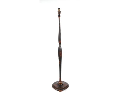 An early 20th century chinoiserie standard lamp decorated with gilt figures on a black ground.  