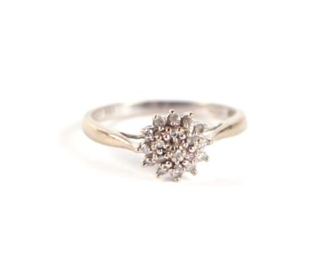 A 9ct white gold and diamond flower head cluster ring, approx UK size 'L', 2g.