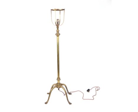 A WAS Benson Arts &amp; Crafts standard lamp with rise and fall mechanism, on quatrefoil bases, converted to electricity, 130