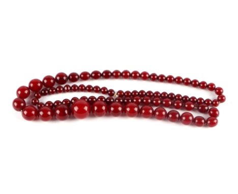 A graduated cherry amber bead necklace, 48g, approx 72cm long.Condition ReportAll of the beads have visible swirl/patterns wh