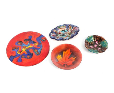 A mid 20th century enamel roundel, 21.5cms diameter; together with three similar enamel dishes (4).