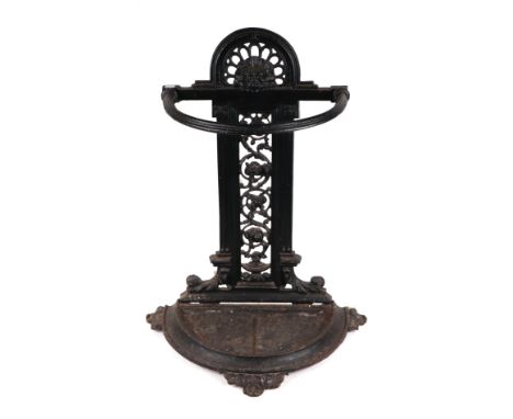 A Victorian cast iron stick stand; together with a quantity of walking sticks and umbrellas to include a Brigg umbrella.
