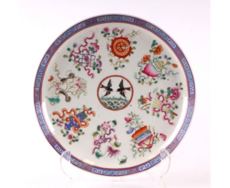 A Chinese famille rose plate decorated with a pair of birds within a border of precious objects, red seal mark to the undersi