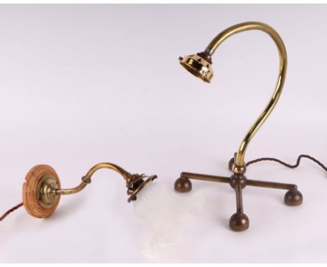 A brass desk lamp on quatrefoil base, 37cm high; together with a similar smaller with a frosted glass shade, 34cm high (2).