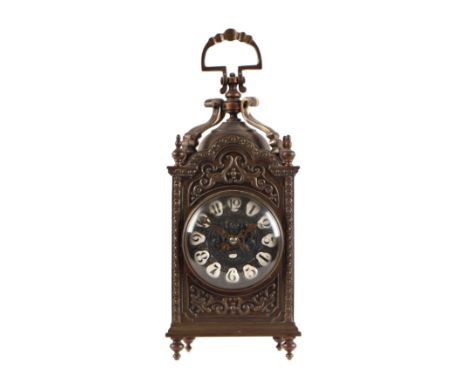 A brass lantern style carriage clock with enamel Arabic numerals, the brass movement striking on a gong, 25cms high.