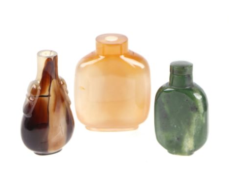 A group of Chinese snuff bottles to include agate and jade / hardstone examples, the largest 7cms high (3).