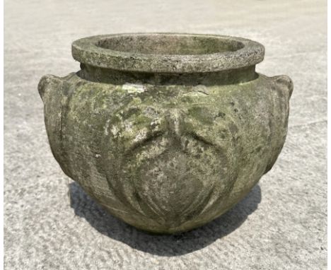 A reconstituted stone planter decorated with roundels, 36cm diameter.