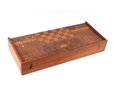 A specimen wood backgammon, chess and other games board, 55cms wide.