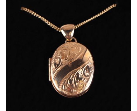 A 9ct gold locket on a 9ct gold chain. 9.9g