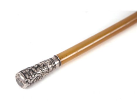 A rhino horn riding crop or swagger stick with Chinese embossed silver coloured metal pommel, 83cm long. Condition ReportThe 