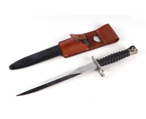 A Swiss M1957 Schmidt Rubin bayonet for the STGW 57, in its scabbard with leather frog. Makers mark W+F for the Waffenfabrik 