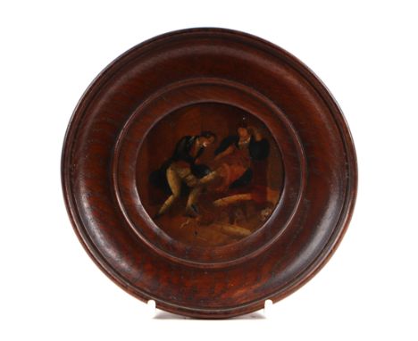 A 19th century portrait miniature depicting a physician attending a seated woman, in a circular oak frame, image 8cm diameter