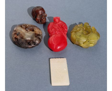 A Chinese jade / hardstone carved panel, 5cm high; together with three similar carvings and a wooden netsuke (5).