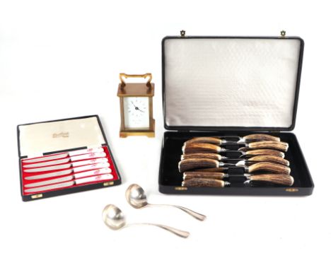 A set of six antler handled steak knives &amp; forks, cased; together with a set of six butter knives with porcelain handles,