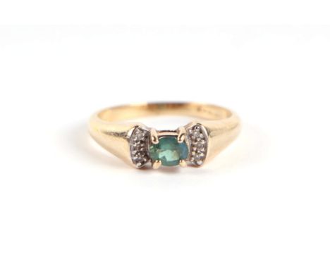 A 9ct gold green stone and diamond bow tie form dress ring, approx UK size 'N', 3g. 