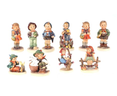 A group of Goebel figures, largest 11cm high (10)Condition ReportThe boy with the rabbits has a chip to the feather on his ca
