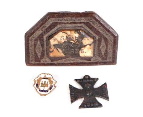 A carved oak and marble trench art desk weight 'Somme 1916-17 Ypres', 11cms wide; together with a WWI propaganda Iron Cross; 