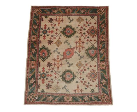 Ushak Carpet of unusual size Central/Western Anatolia, circa 1910 The cream field of angular vines and stylised flower heads 