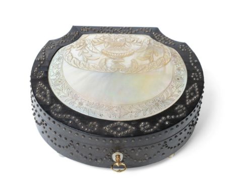 A Palais Royal Ebony Sewing Box, mid 19th century, of scallop form, the hinged cover set with a mother-of-pearl shell carved 