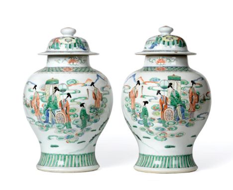 A Pair of Chinese Porcelain Jars and Covers, Kangxi reign mark but late 19th century, of baluster form, painted in famille ve