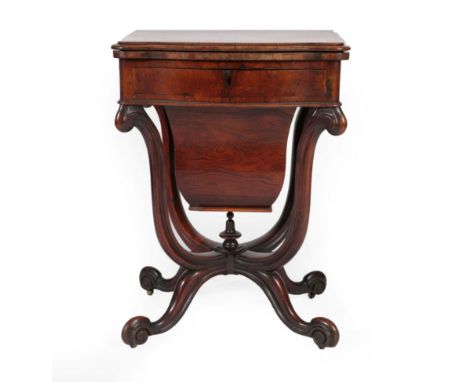 A Victorian Rosewood Games and Sewing Table, mid 19th century, of serpentine shape form, the moulded top enclosing a chess bo