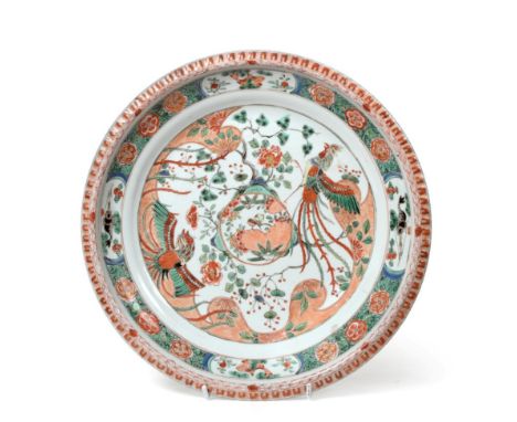 A Chinese Porcelain Dish, Kangxi, painted in famille verte enamels with a birds amongst foliage within a foliate border 35cm 