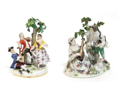 A Meissen Porcelain Figure Group, late 19th/early 20th century, as an 18th century gallant holding posies of flowers beside a