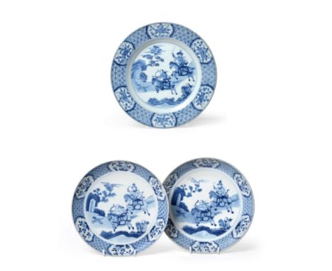 A Pair of Chinese Porcelain Saucer Dishes, Kangxi/Yongzheng, painted in underglaze blue with warriors on horseback within lat