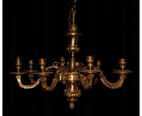 A Gilt Metal Eight-Light Chandelier, in Louis XIV style, with baluster column and leaf sheathed square section scroll branche