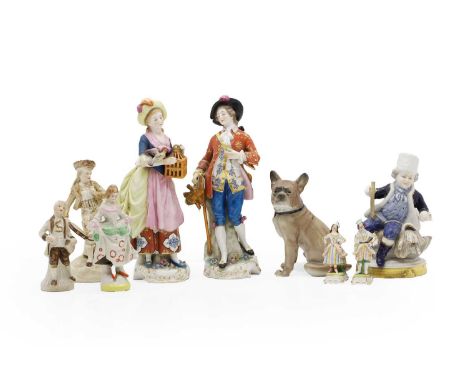 A collection of porcelain figures 20th century, comprising a Volkstedt figure of a dog, 14.9cm high, a figure of a boy in a f