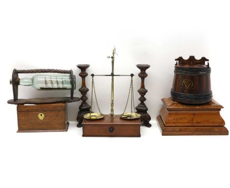 A pair of turned candlesticks, 20th century, Continental, 31.5cm high;together with a ship in a bottle, in a spiral carved st