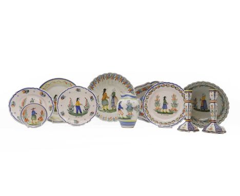 A collection of Quimper French pottery 19th century and later, to include a set of bowls decorated with a figure and floral b