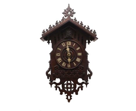 A Black Forest cuckoo wall clock late 19th early 20th century, bearing a Camerer, Kuss &amp; Co. trade label to reverse, the 