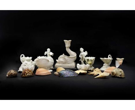 A collection of shell pottery, 20th century, comprisinga pair of Royal Worcester and Coalport salts, 12cm high;another pair o